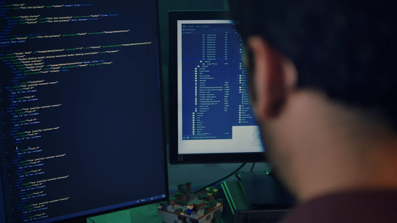 A developer writing code on two screens